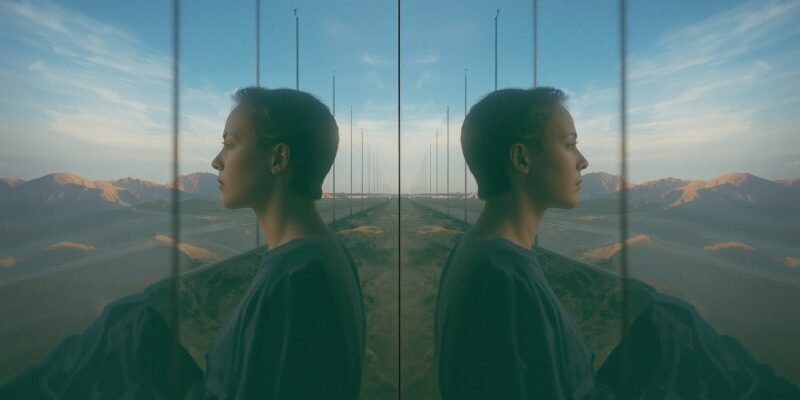 Illustration of a person encountering their identical doppelganger, symbolizing questions of identity, uniqueness, and alternate life paths.