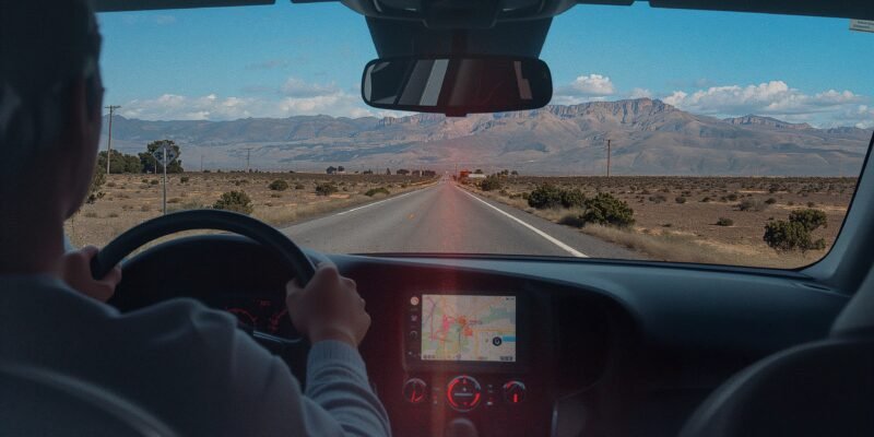 Illustration of a driver deciding between GPS directions and personal intuition, symbolizing reliance on technology versus human judgment and experience.