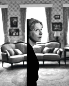 A contemplative adult standing in their childhood home, wondering what is wrong with me while experiencing emotional detachment and an identity crisis.