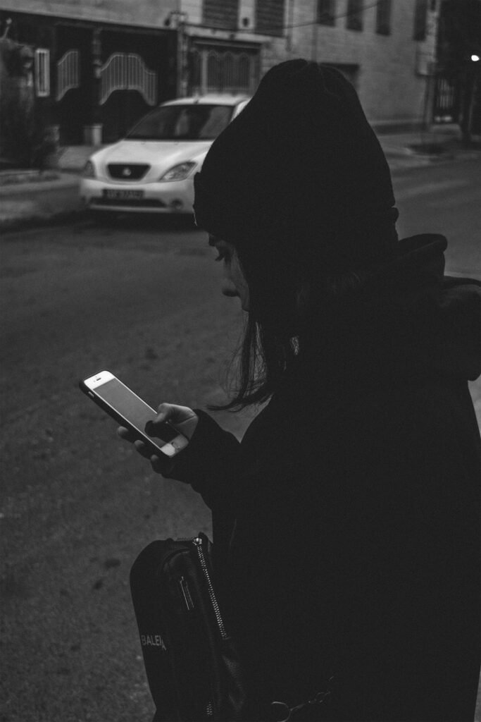A person surrounded by technology but feeling isolated and lonely.