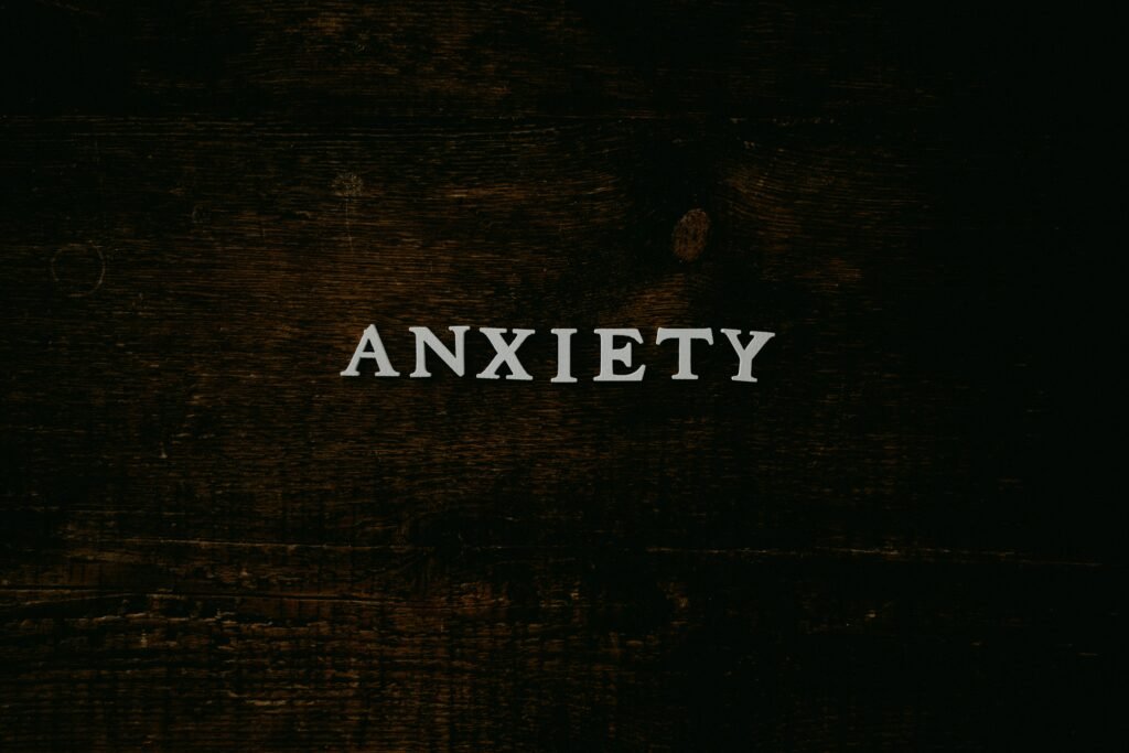 A person feeling trapped by financial limitations despite smartphone technology.