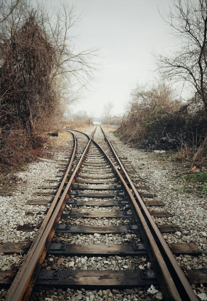 A person standing at a crossroads representing missed opportunities and life choices.