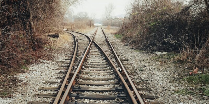 A person standing at a crossroads representing missed opportunities and life choices.