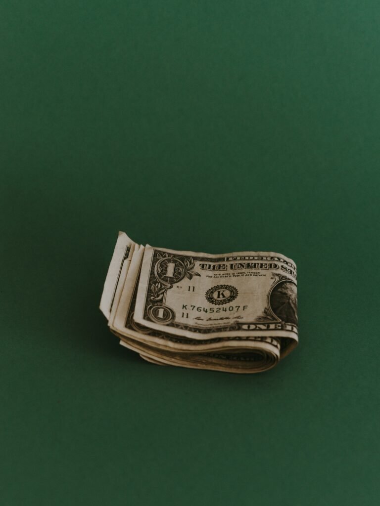 A person surrounded by money but feeling empty and contemplative.