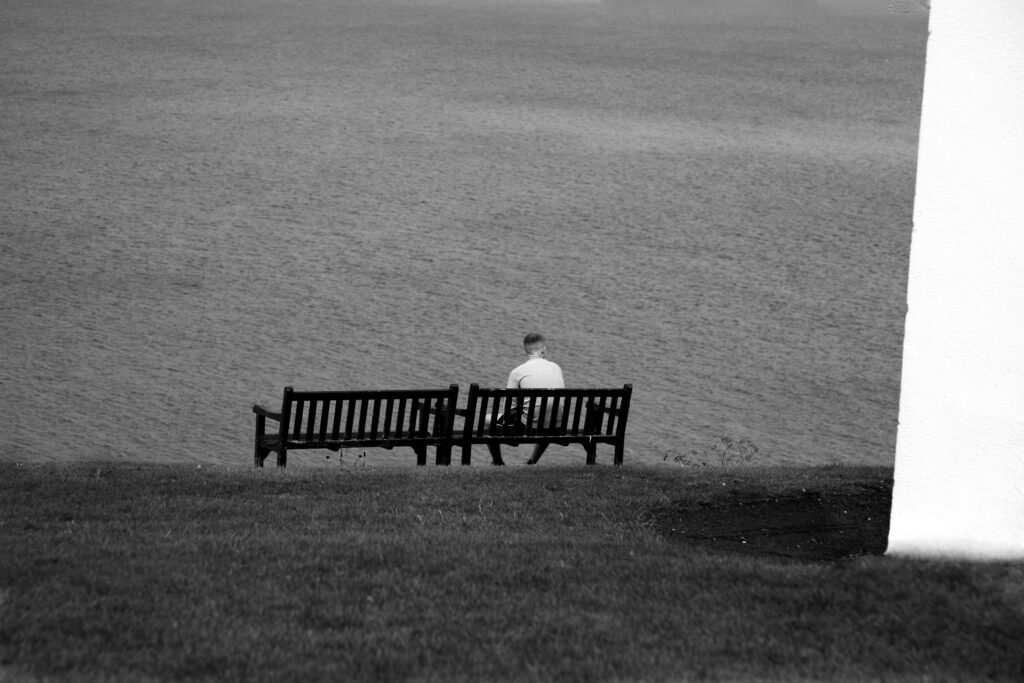 A person deep in thought contemplating life's unanswerable questions.